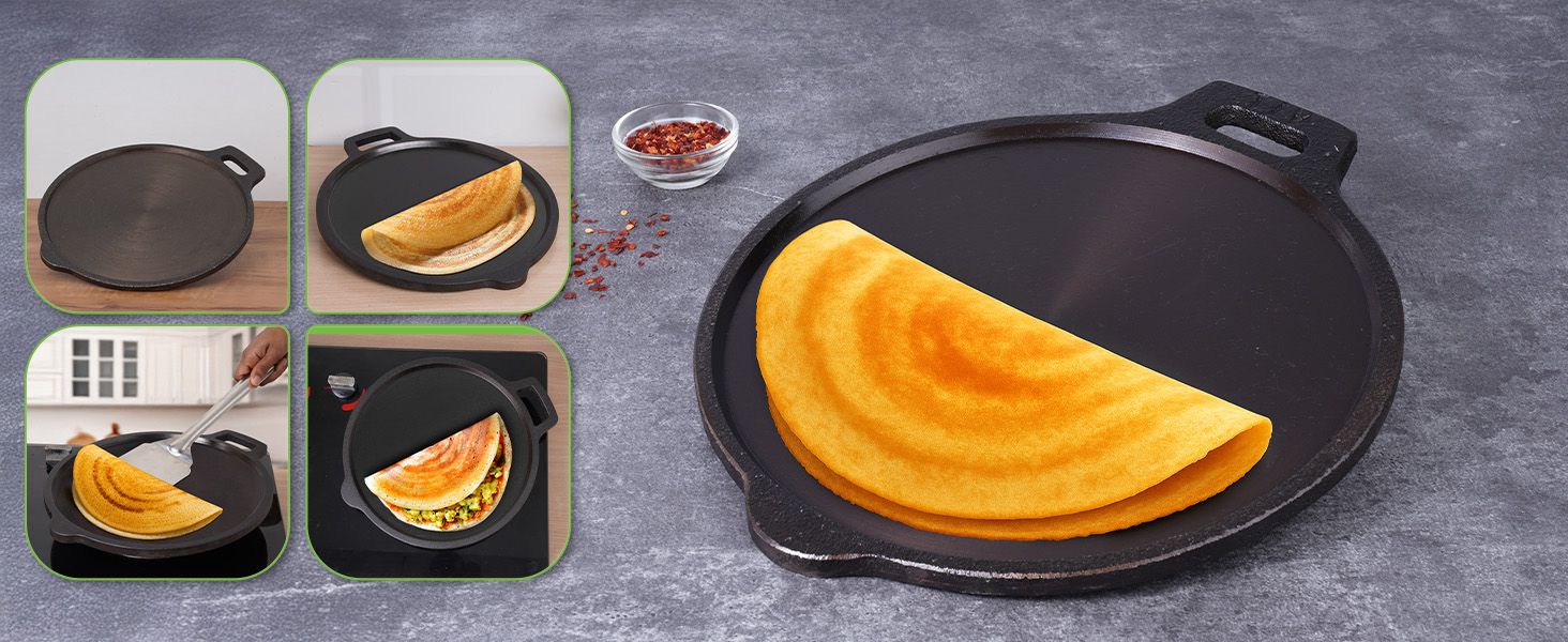 A dosa cooking evenly on a cast iron tawa